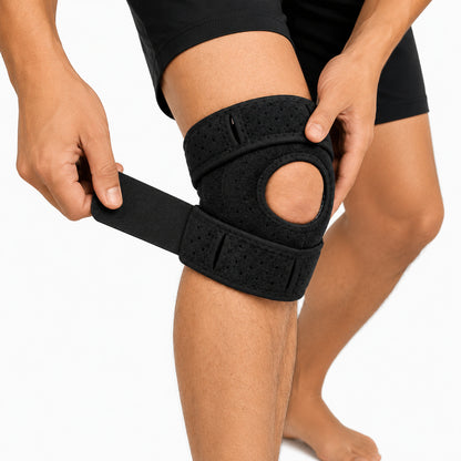 Genouillère réglable avec ouverture pour la rotule et sangle de compression pour la stabilité, le soulagement et un ajustement confortable.