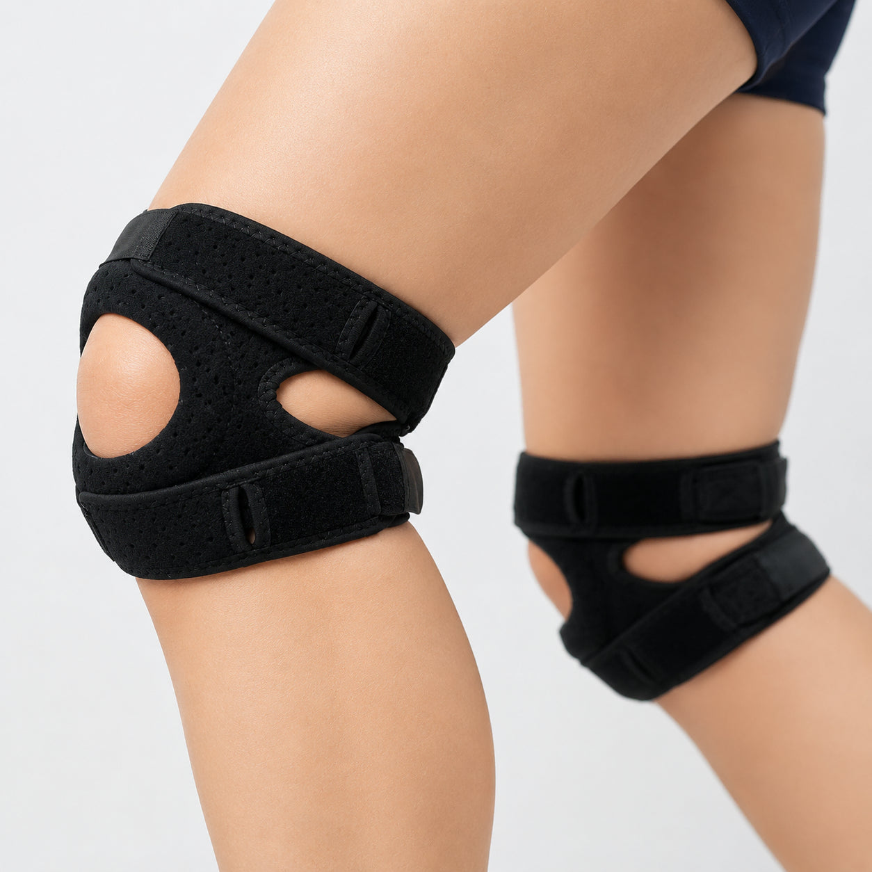 Genouillère réglable avec ouverture pour la rotule offrant stabilité et soutien en cas de genou du sauteur et de maladie d'Osgood-Schlatter.